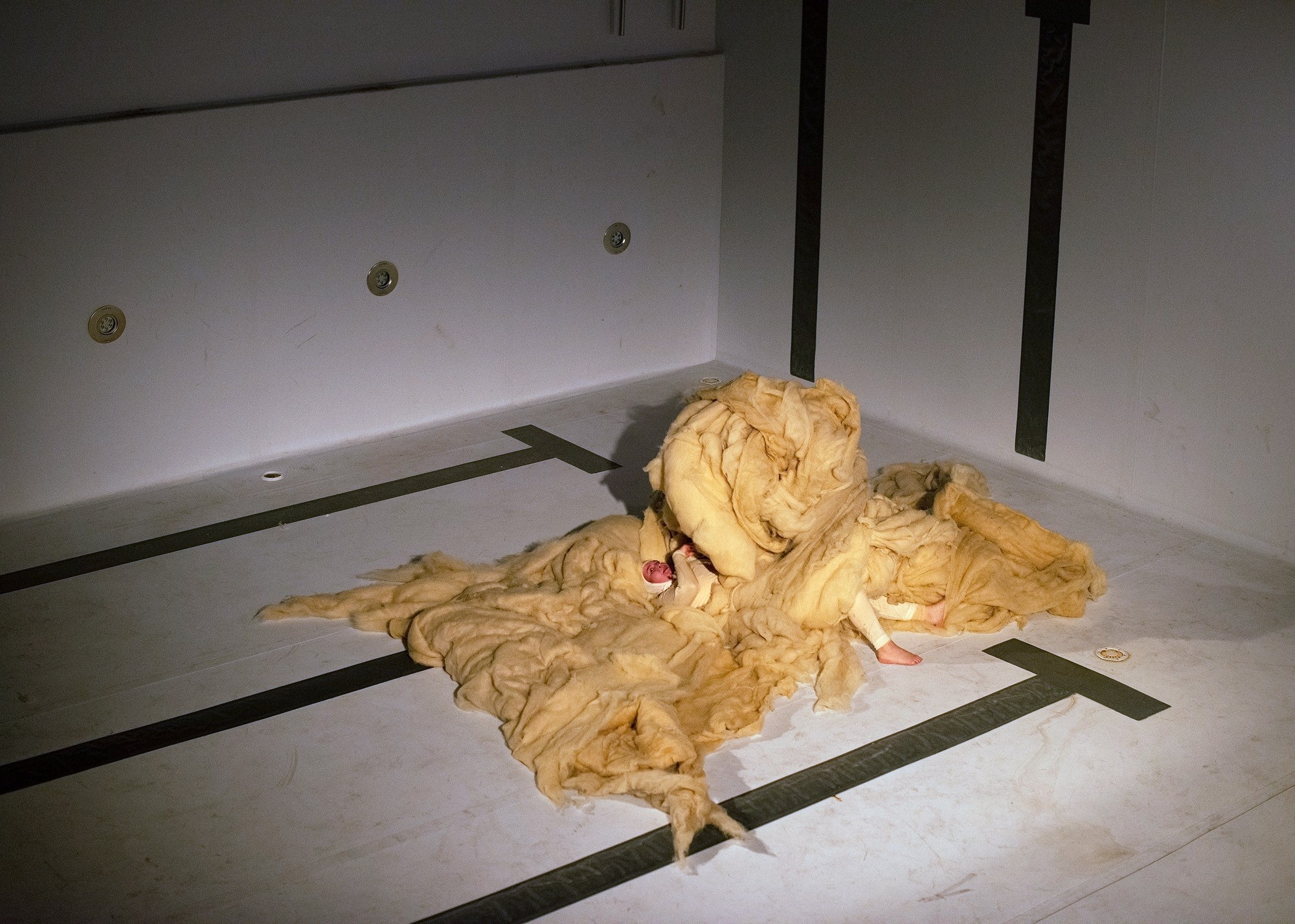 WOOLWALKER - performance by Marita Isobel Solberg at Alfheim public bath in Tromsø, 2022. Photo: Mihaly Stefanovicz